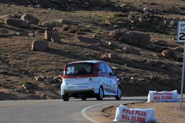 2012 PPIHC Practice Day Three - An essentially stock version of the electric-powered 2012 Mitsubishi i, driven by International off-road series race-winning driver Beccy Gordon in a practice run at the 2012 Pikes Peak International Hill Climb.