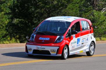 2012 PPIHC Practice Day One .An essentially stock version of the electric-powered 2012 Mitsubishi i, driven by Beccy Gordon, in a practice run on the lower section (Starting Line to Glen Cove) of the 2012 Pikes Peak International Hill Climb.