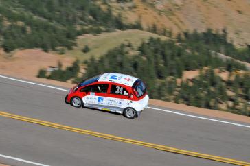 2012 PPIHC Practice Day Two.An essentially stock version of the electric-powered 2012 Mitsubishi i, driven by International off-road series race-winning driver Beccy Gordon, in a practice run in the middle section of the 2012 Pikes Peak International Hill Climb.