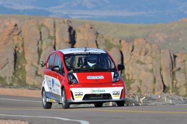2012 PPIHC Practice Day Three - An essentially stock version of the electric-powered 2012 Mitsubishi i, driven by International off-road series race-winning driver Beccy Gordon in a practice run at the 2012 Pikes Peak International Hill Climb.
