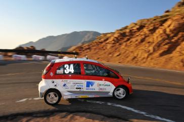 2012 PPIHC Practice Day Two.An essentially stock version of the electric-powered 2012 Mitsubishi i, driven by International off-road series race-winning driver Beccy Gordon, in a practice run in the middle section of the 2012 Pikes Peak International Hill Climb.